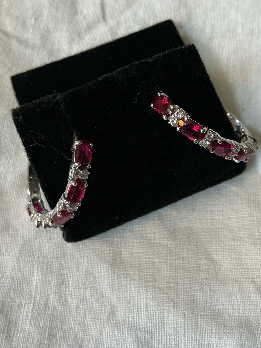 10kt white gold ruby/diamond huggie earrings (135-9)